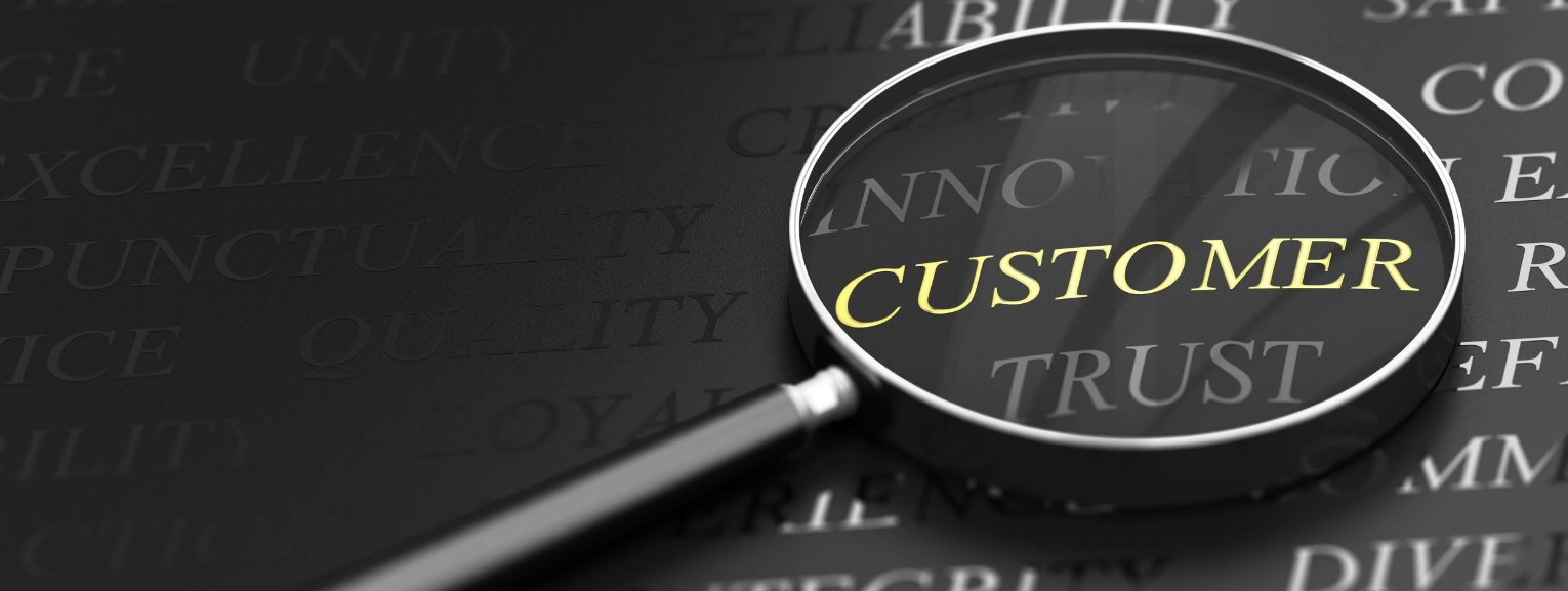 A focused glass showing a customer, symbolizing the importance of understanding and meeting customer needs for business success and satisfaction.