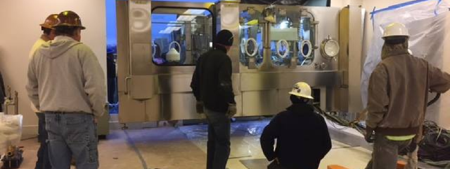 Pharmaceutical manufacturing team during facility expansion and equipment upgrade.